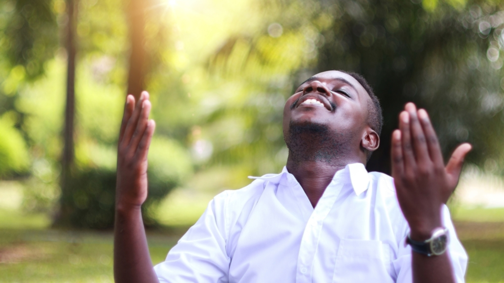 African,Man,In,White,Shirt,Praying,For,Thank,God,In